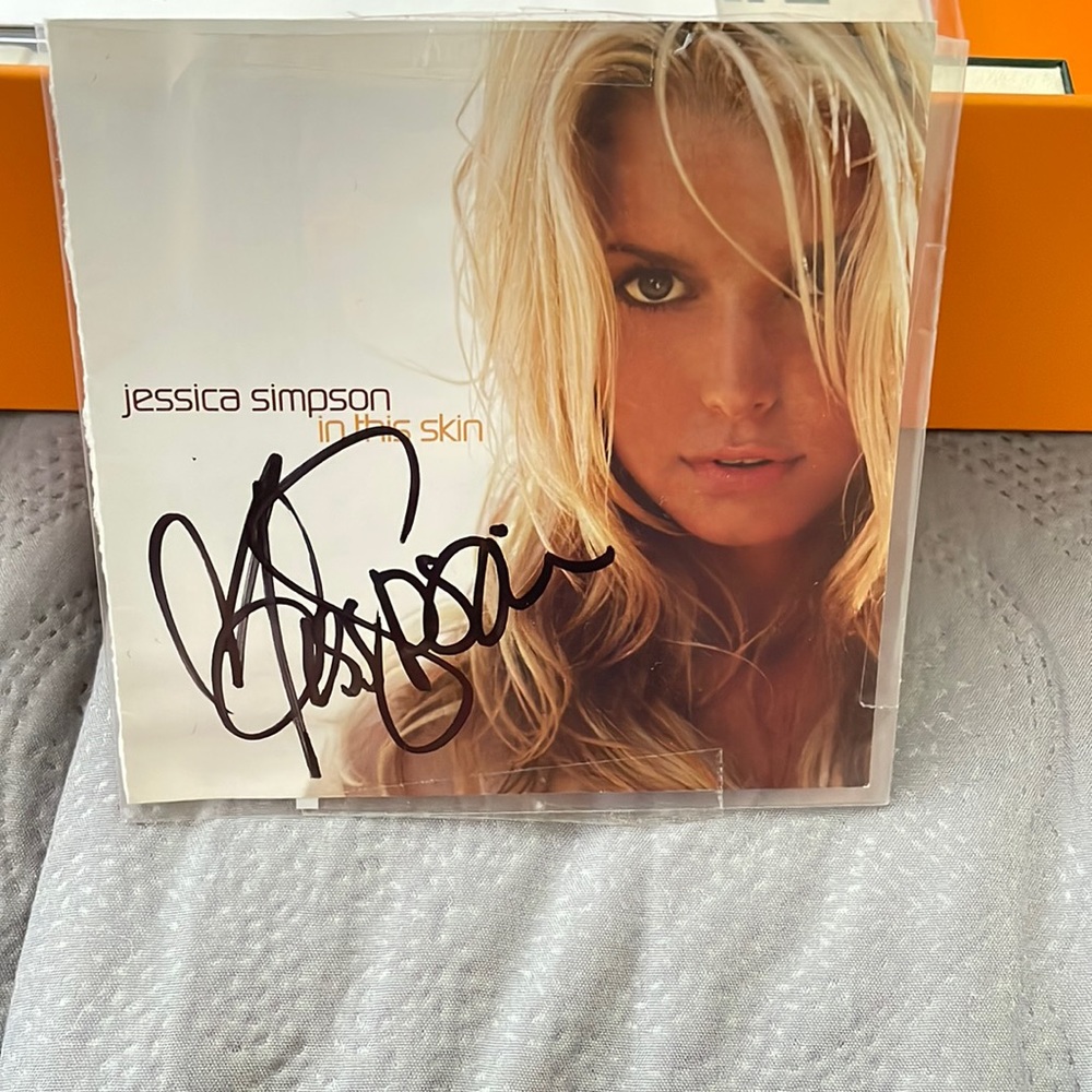 Authentic Jessica Simpson autographed album cover